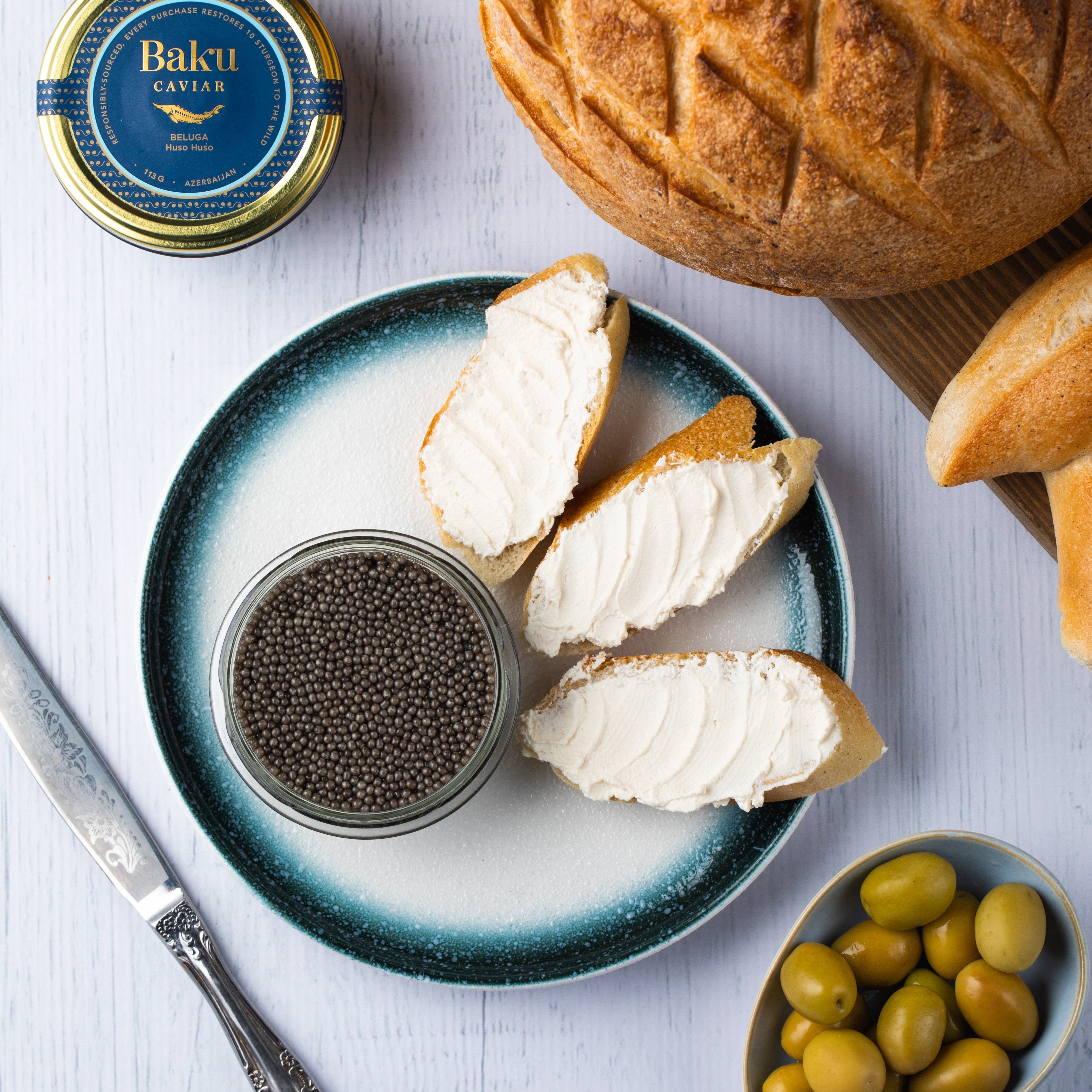 Caviar served with bread and refined accompaniments