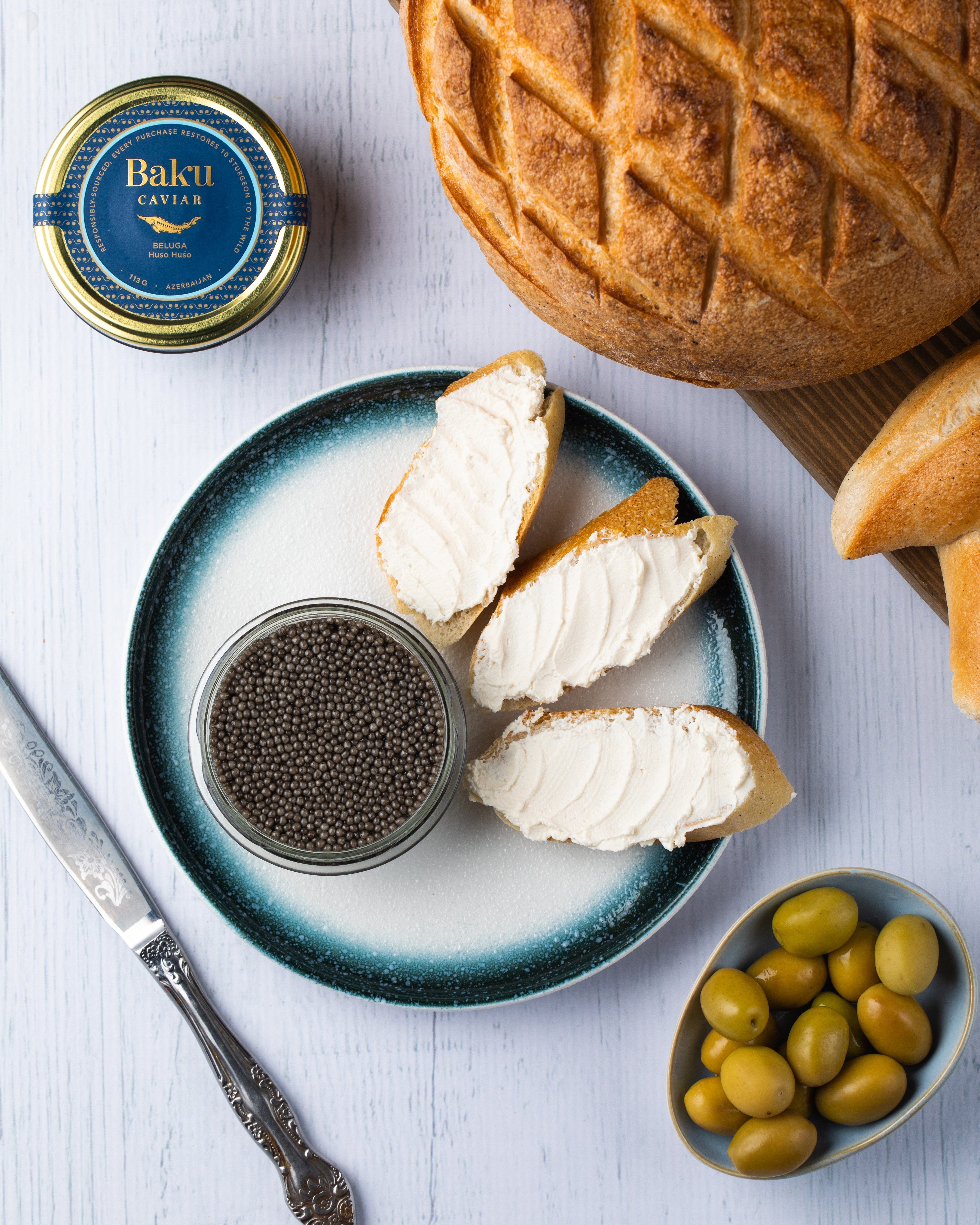 Caviar served with bread and refined accompaniments