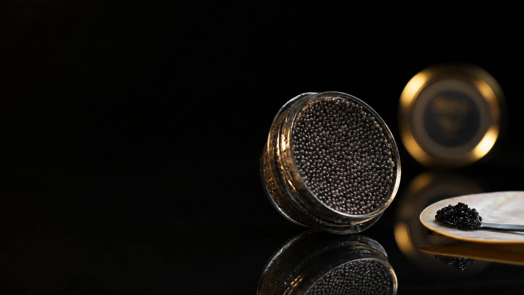 Luxury caviar presentation in soft golden light